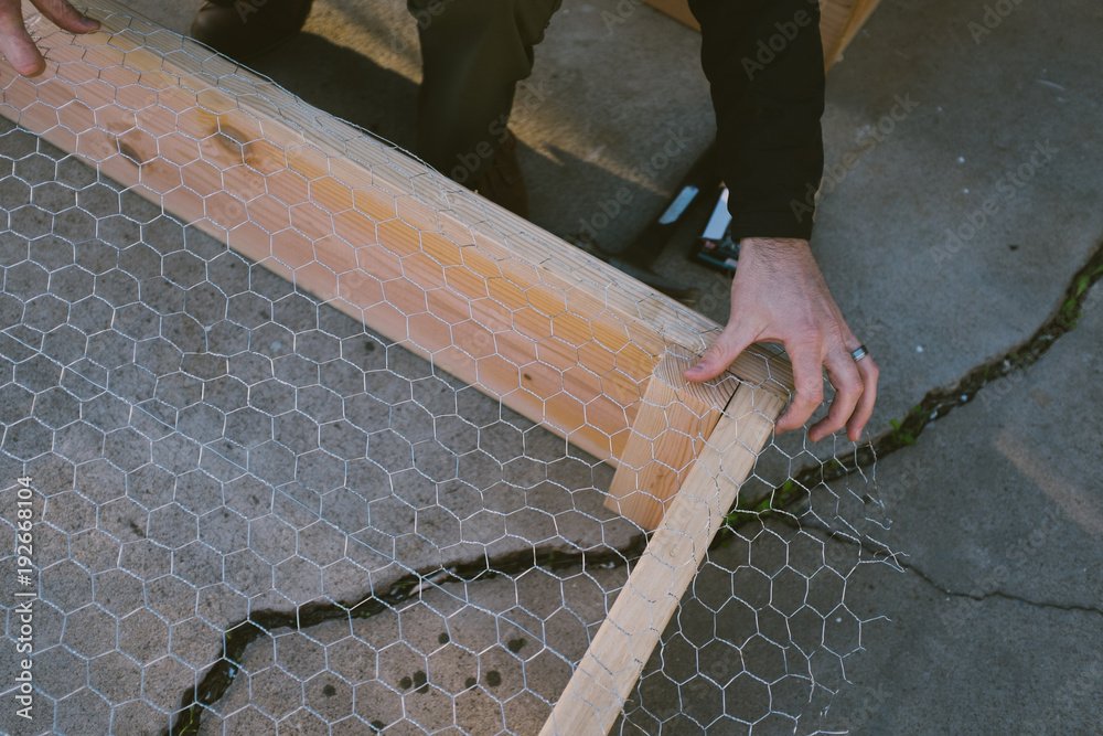 man building garden bed